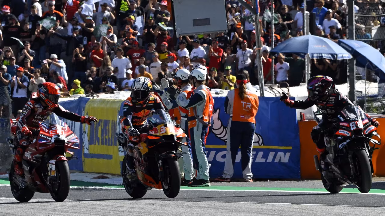 Marquez and Martin congratulate Acosta, 2026 Red Bull Ring MotoGP. © Gold and Goose