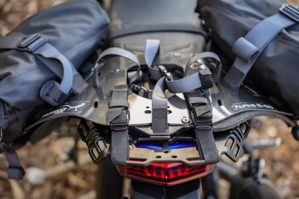 A total of four cam-buckle mounting straps offer a secure fit, while Velcro strap keepers keep everything tidy and out of the rear wheel.