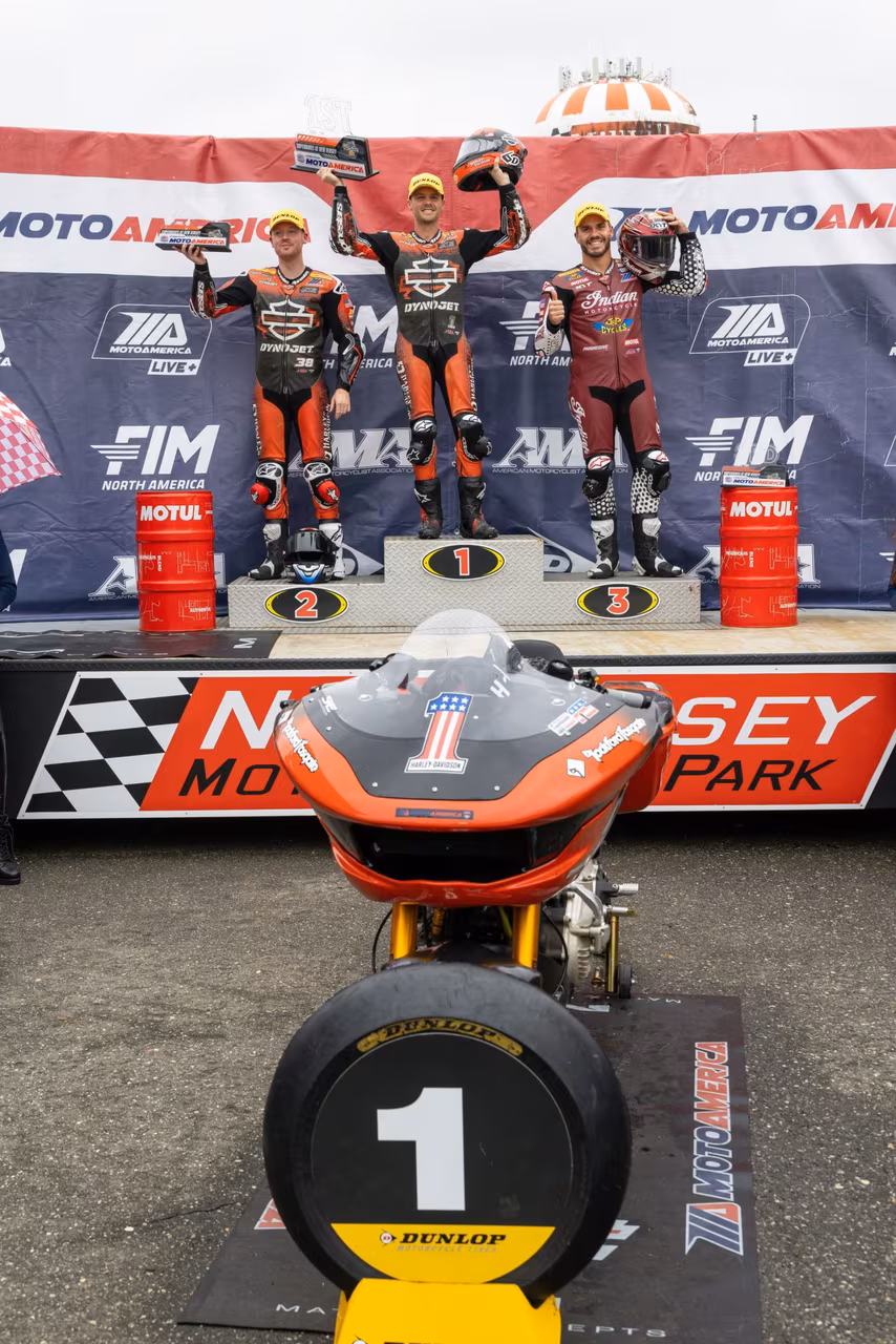 Race 2 winner and 2025 King Of The Baggers Champion Kyle Wyman (center) on the podium at NJMP, flanked by teammate Bradley Smith (left) and 2026 King Of The Baggers Champion Hayden Gillim (right). The